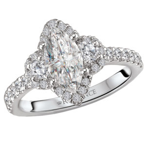 This elegant ring features a 3-stone look with a marquise halo center created with round sparkling diamonds set in 14kt white gold. (D 1/2 carat total weight) This ring is a SEMI-MOUNT and it comes with NO CENTER STONE as shown but it will accommodate a 10x5mm marquise cut round center stone.