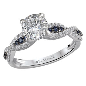 Dazzling engagement ring created in high polished 14kt white gold showcases a braided shank aligned with brilliant cut diamonds and sapphires surrounding the center stone setting that will accommodate a round 6.5mm diamond or gemstone. (D 1/5cw and S .08 cw)
