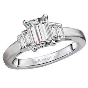 This beautiful 14kt white gold semi-mount engagement ring features sparkling baguette diamonds beside a setting that will accommodate a 7x5mm emerald cut diamond of your choosing. (D 1/3 carat weight)