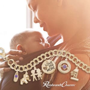 mom and baby with charm bracelet featuring birthstone charms