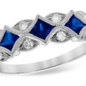 Allison Kaufman Blue Sapphire diamond milgrain 14ktw band looks like set on point with 3 princess sapphire and 12 round diamonds. Sapphire gem weight is .55 and total stone weight is .70ct 