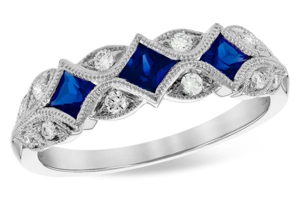 Allison Kaufman Blue Sapphire diamond milgrain 14ktw band looks like set on point with 3 princess sapphire and 12 round diamonds. Sapphire gem weight is .55 and total stone weight is .70ct 